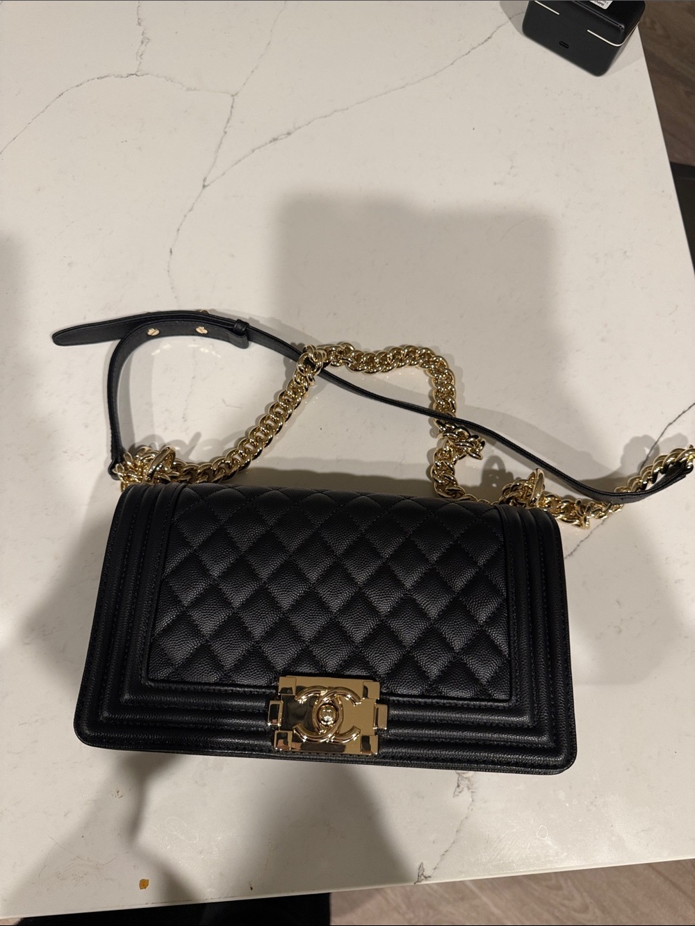 Black quilted bag gold hardware